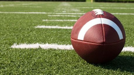 football sitting on turf field